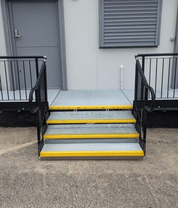 Metal Step Units with high-visibility yellow nosing, providing clear step definition to help improve safety and confidence when entering or leaving the building.